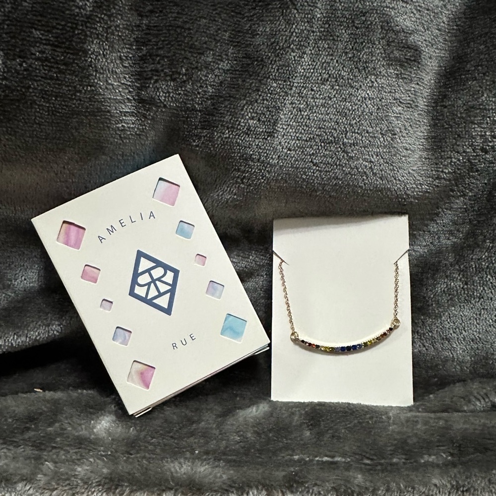 Amelia Rue Gold Tone curved rainbow necklace